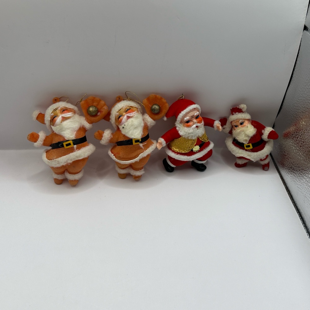 Four vintage red felt Santa ornaments